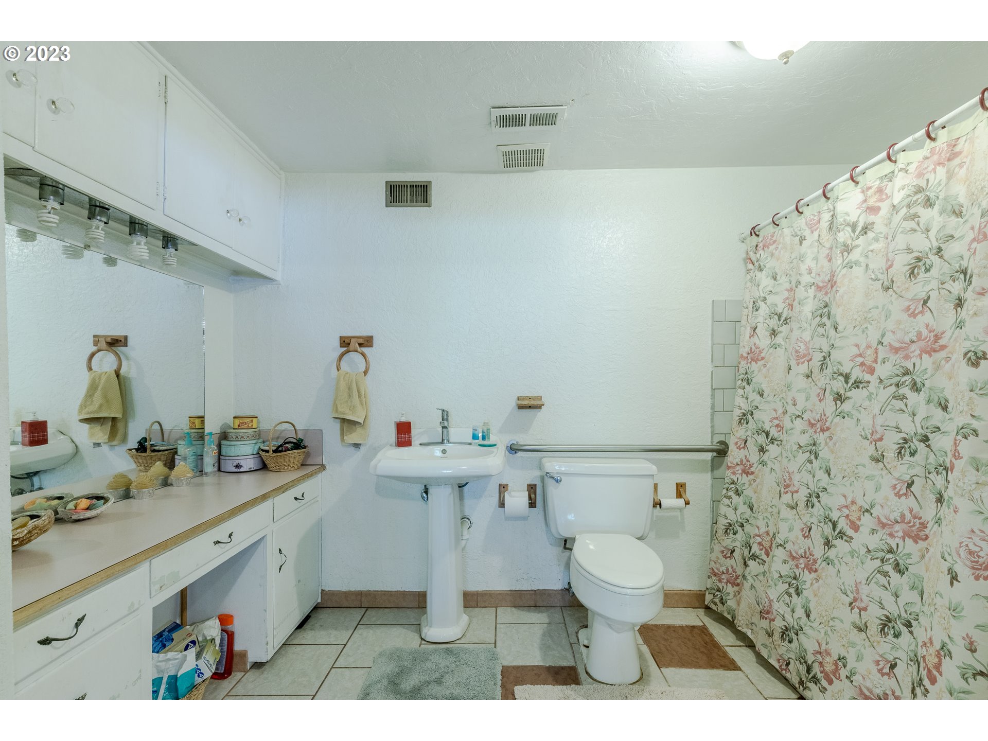 6585 Main Street Springfield, OR 97478 - Photo 27 of 30 a bathroom with a sink mirror vanity and toilet