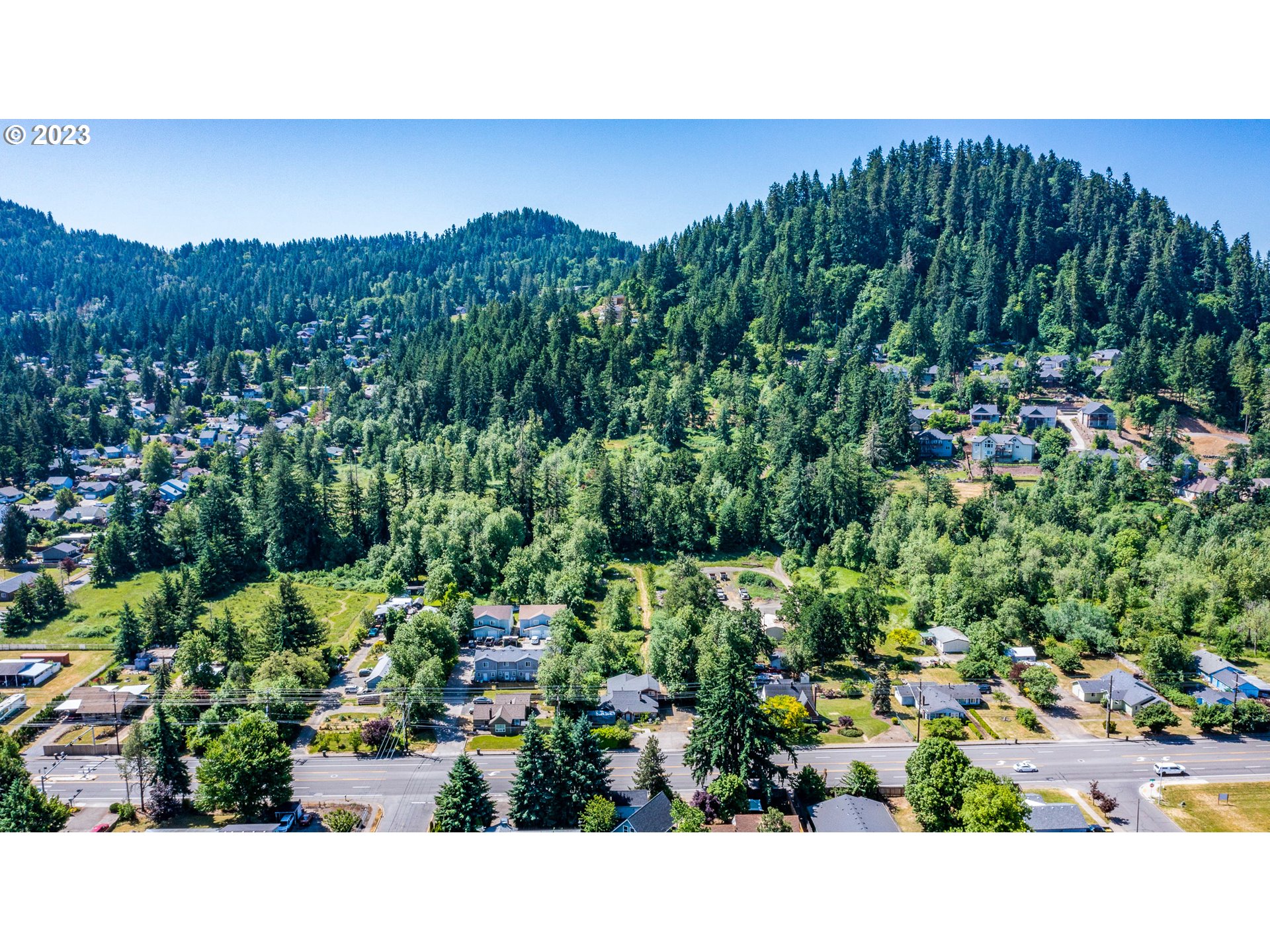 6585 Main Street Springfield, OR 97478 - Photo 30 of 30 a view of a garden with a lot of plants and a bench