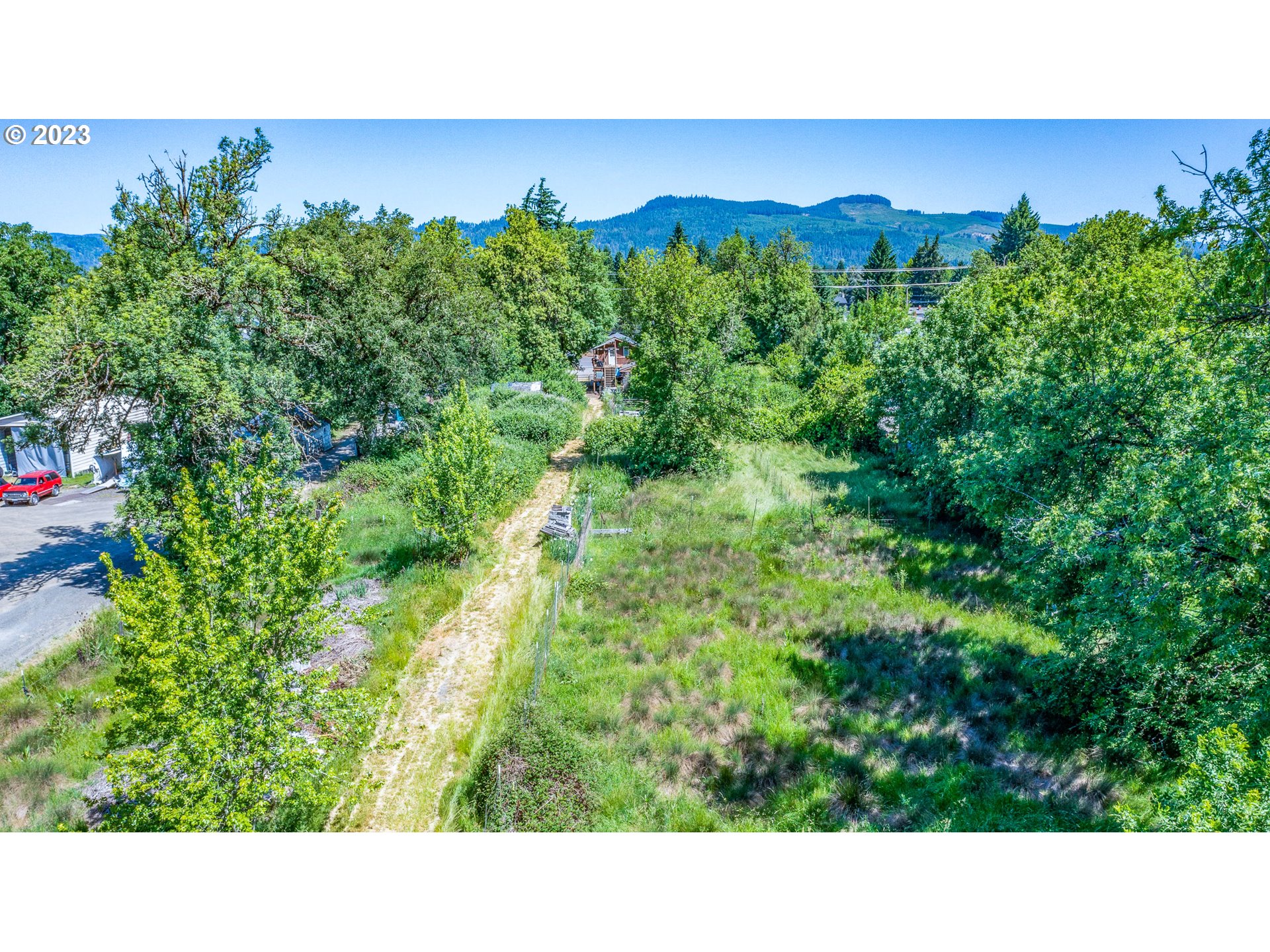 6585 Main Street Springfield, OR 97478 - Photo 3 of 30 a open area with lots of green trees in the background