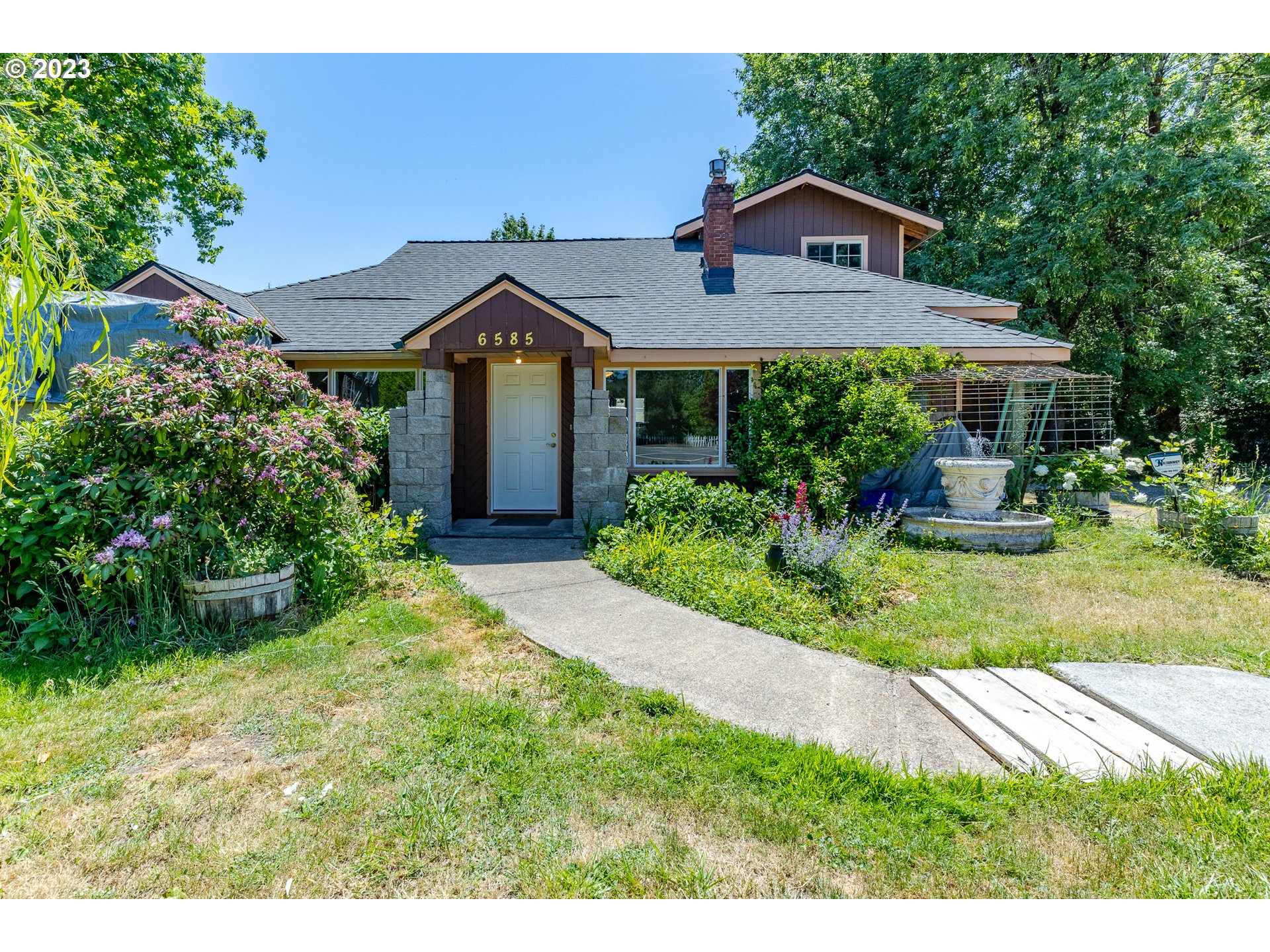 6585 Main Street Springfield, OR 97478 - Photo 9 of 30 a front view of a house with a yard