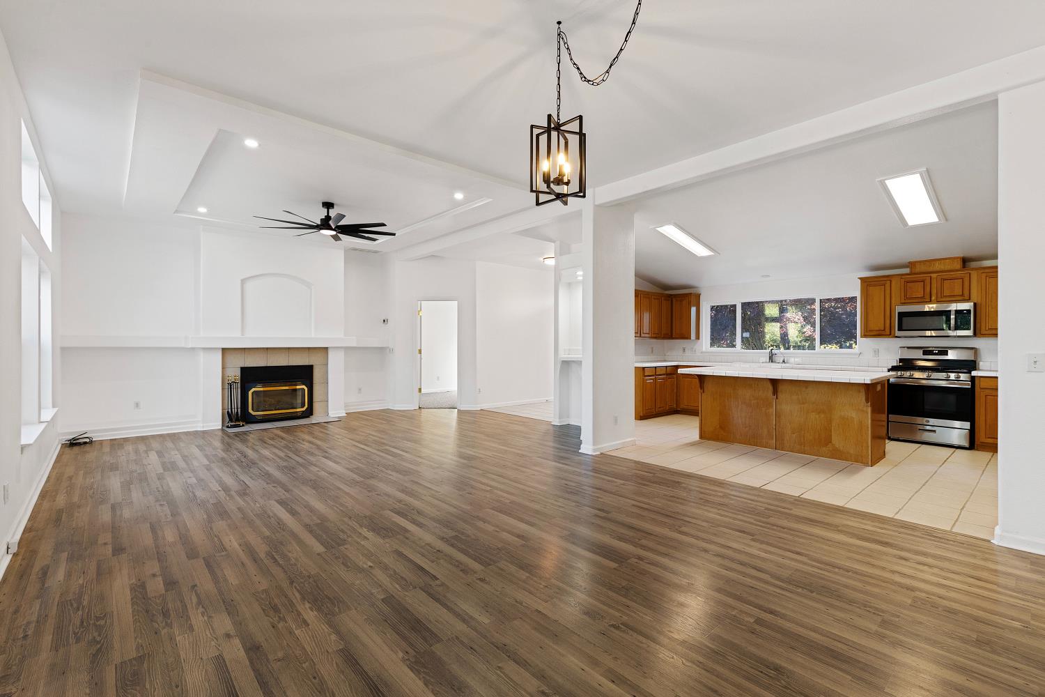 8181 West Kile Road Thornton, CA 95686 - Photo 12 of 65 a view of kitchen with microwave a stove and furniture