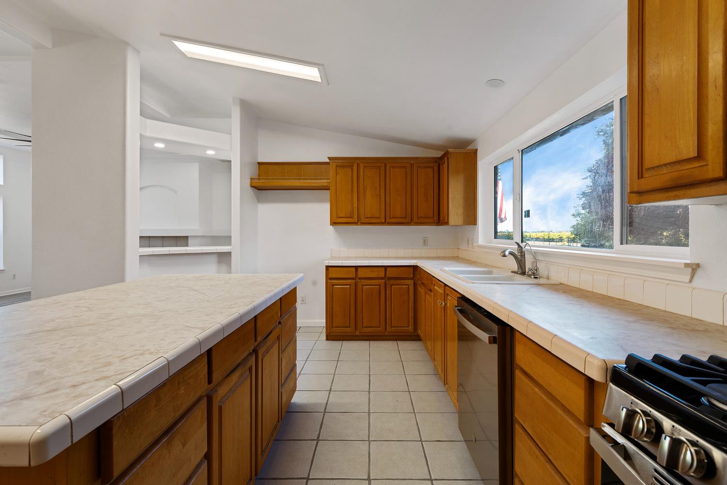 8181 West Kile Road Thornton, CA 95686 - Photo 15 of 65 a kitchen with stainless steel appliances granite countertop a sink and cabinets