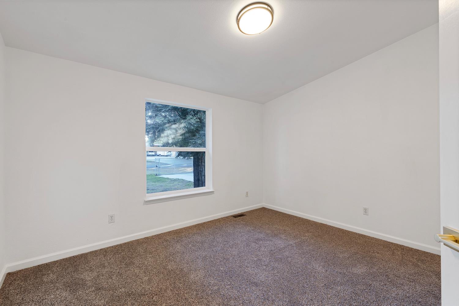 8181 West Kile Road Thornton, CA 95686 - Photo 18 of 65 an empty room with a window