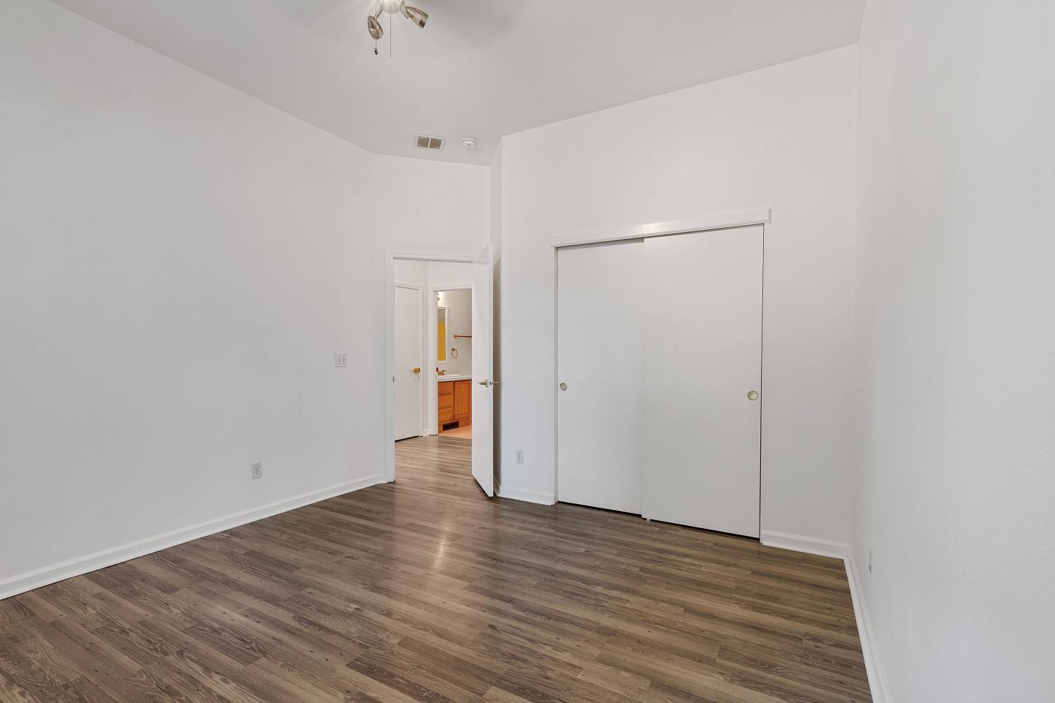 8181 West Kile Road Thornton, CA 95686 - Photo 21 of 65 a view of an empty room with wooden floor