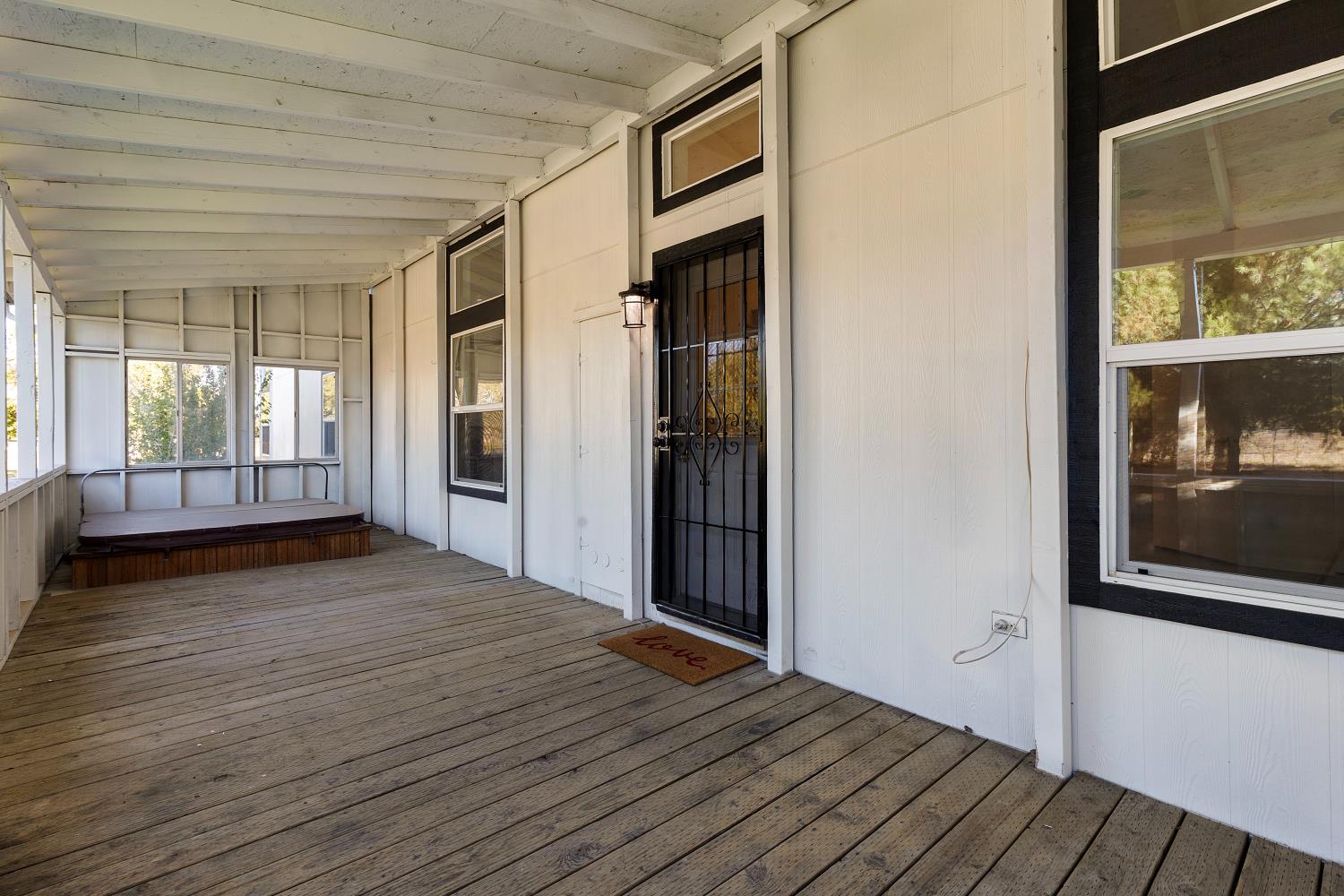 8181 West Kile Road Thornton, CA 95686 - Photo 32 of 65 a view of an empty room with wooden floor and a window