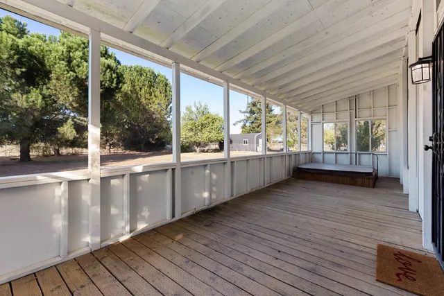 a view of empty room with wooden ceiling