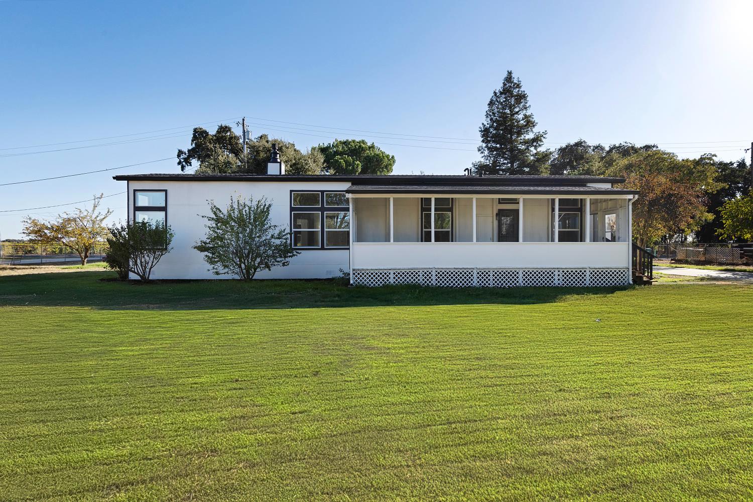 8181 West Kile Road Thornton, CA 95686 - Photo 35 of 65 a front view of a house with a yard
