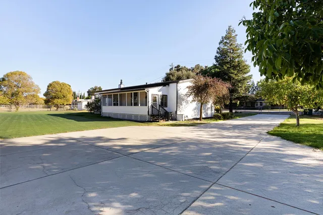 a view of a house with a big yard