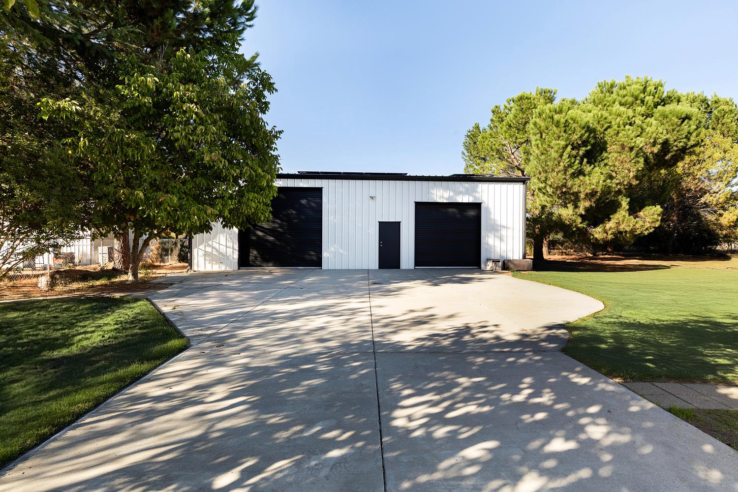 8181 West Kile Road Thornton, CA 95686 - Photo 41 of 65 a front view of a house with a yard and garage