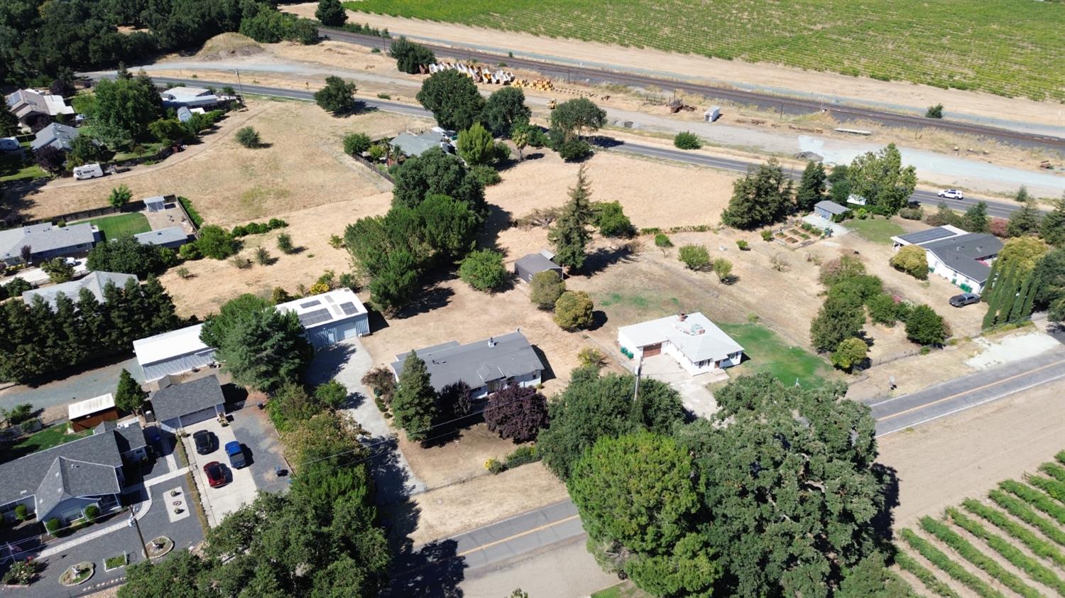 8181 West Kile Road Thornton, CA 95686 - Photo 62 of 65 an aerial view of a house with a yard and lake view