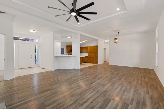 a view of kitchen with microwave a stove and furniture