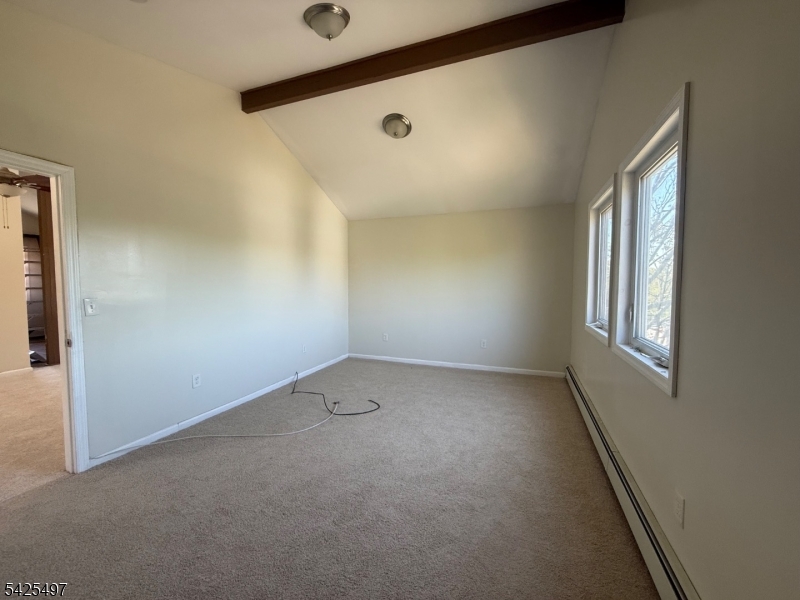 74 Spring Street Bloomfield, NJ 07003 - Photo 5 of 9 an empty room with windows