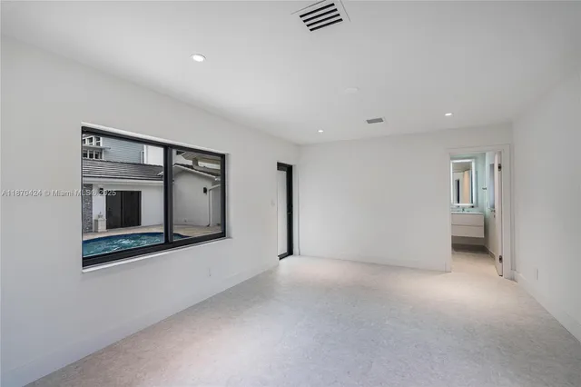 a spacious bathroom with a bathtub and shower