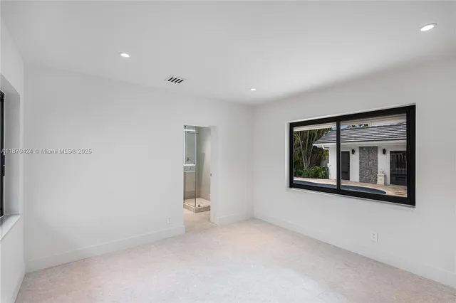a bathroom with a sink toilet and mirror