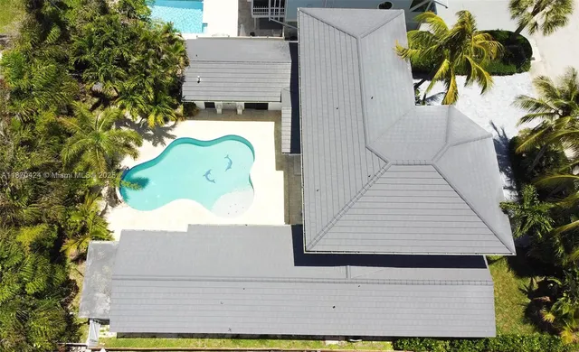 a front view of a house with a yard and a garage