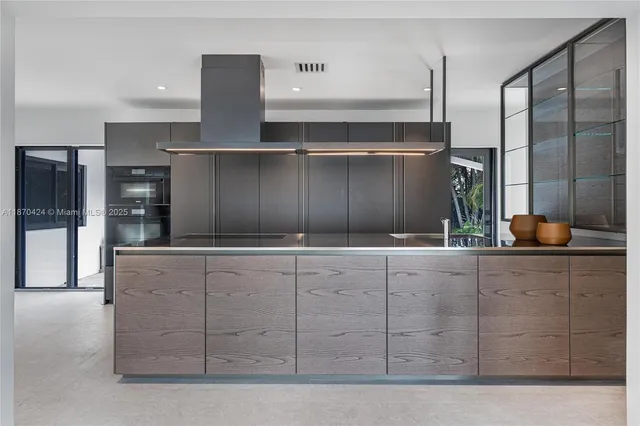 a kitchen with stainless steel appliances wooden cabinets and a counter top space