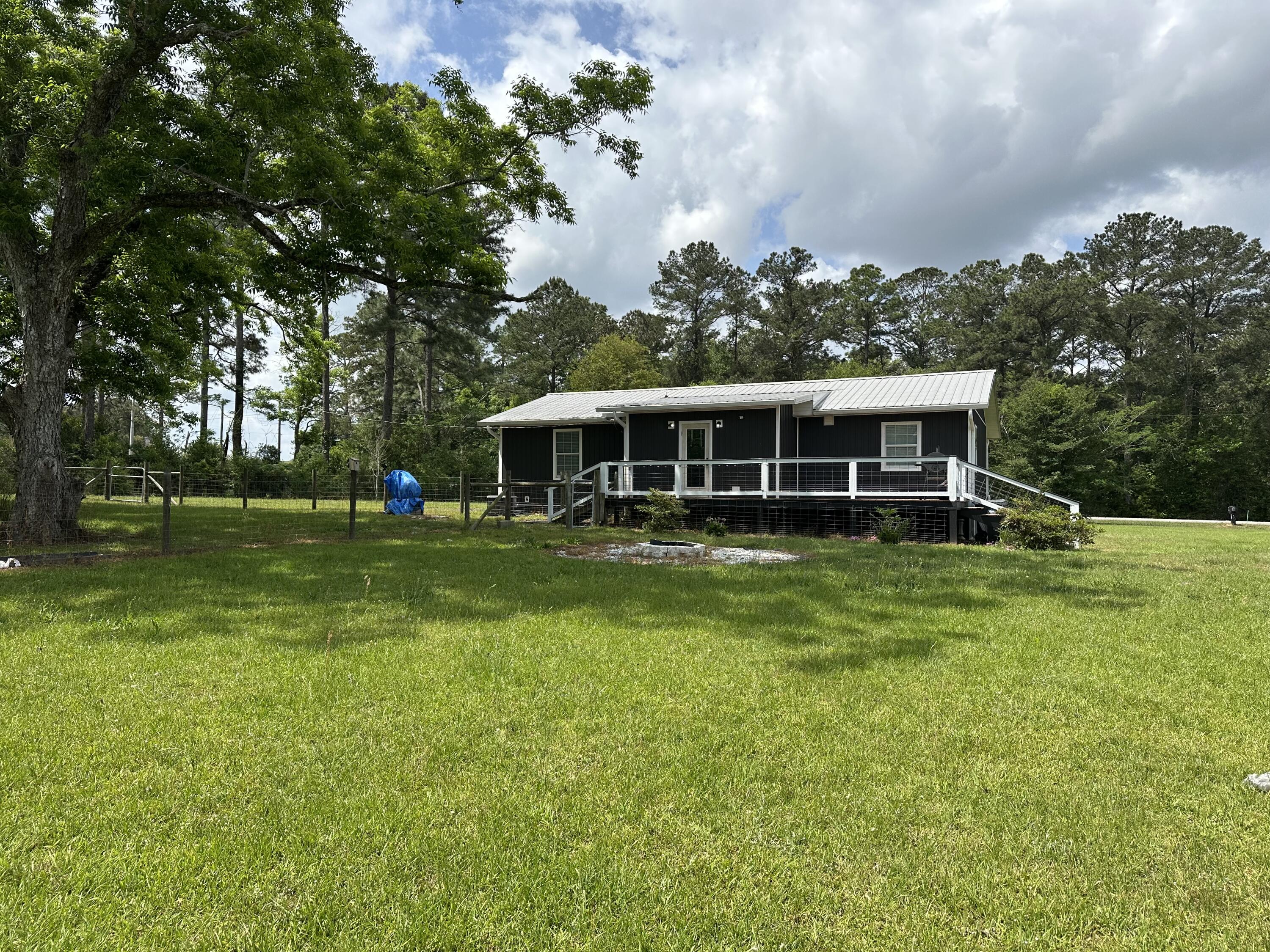 10712 Highway 331 DeFuniak Springs, FL 32433 - Photo 13 of 56 a view of a house with a big yard