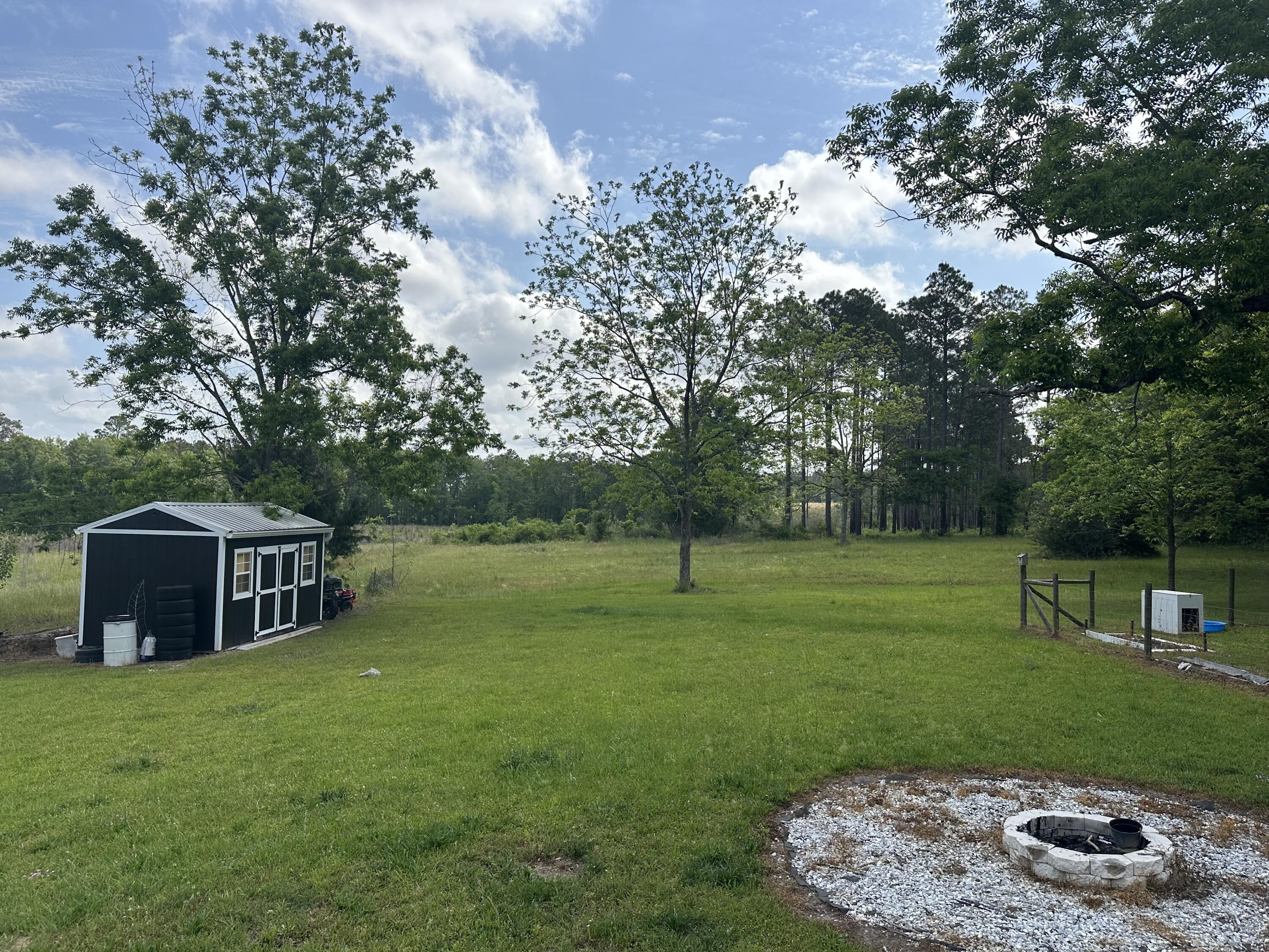 10712 Highway 331 DeFuniak Springs, FL 32433 - Photo 42 of 56 a view of a house with a backyard