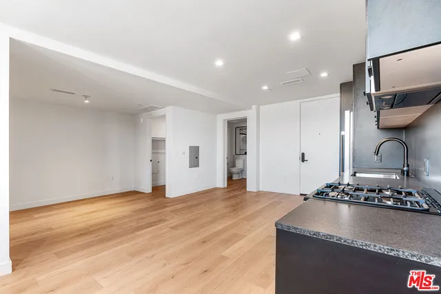 a view of kitchen with sink and natural light