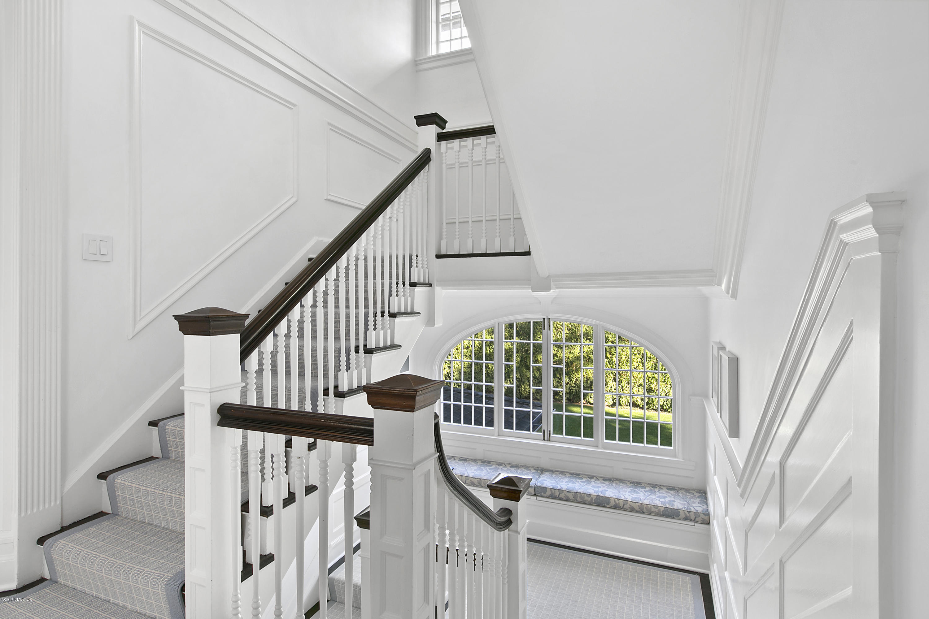 133 Otter Rock Drive Greenwich, CT 06830 - Photo 14 of 17 a view of staircase with railing and white walls