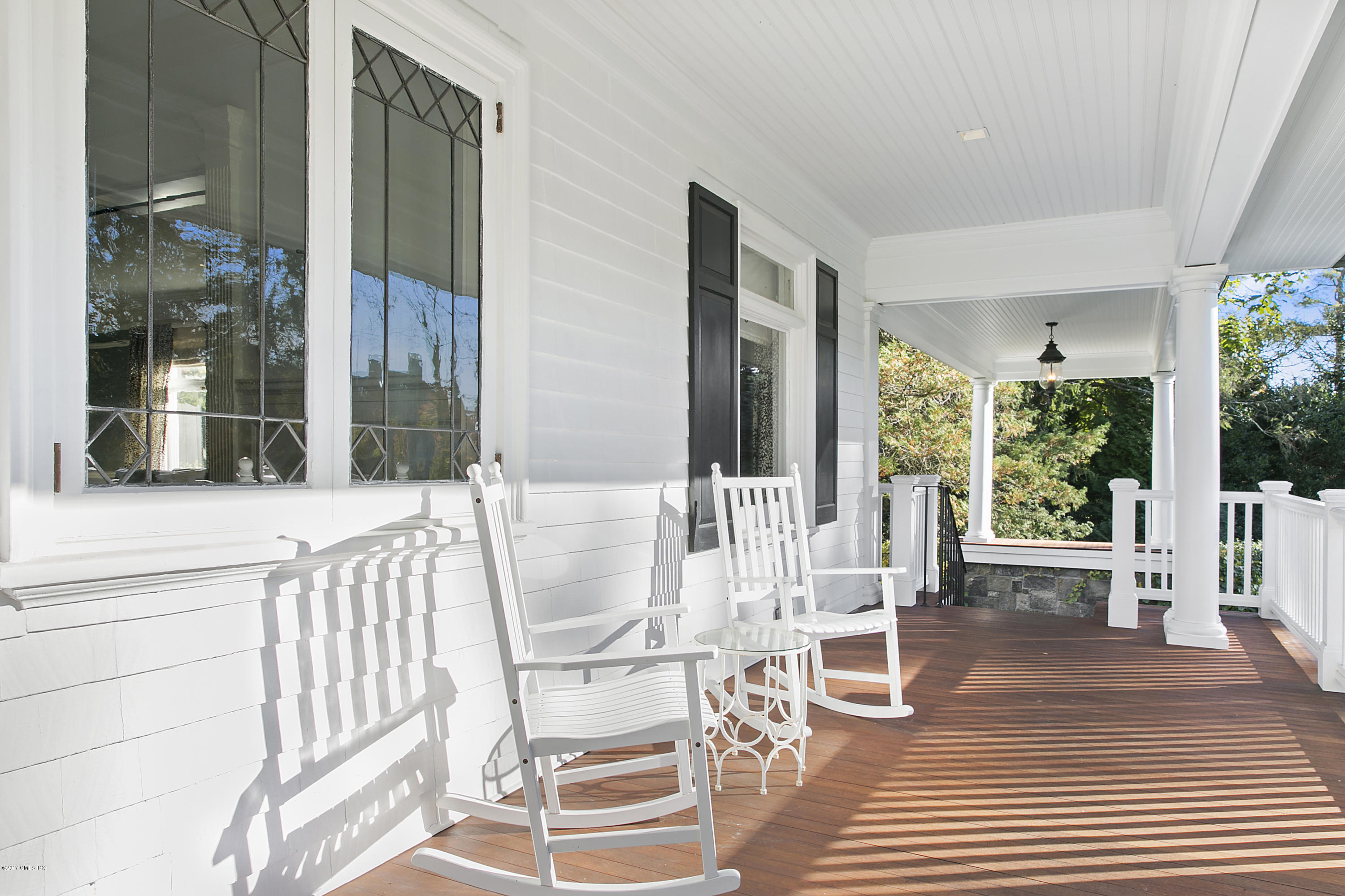 133 Otter Rock Drive Greenwich, CT 06830 - Photo 2 of 17 a view of a dining room with furniture wooden floor and chandelier