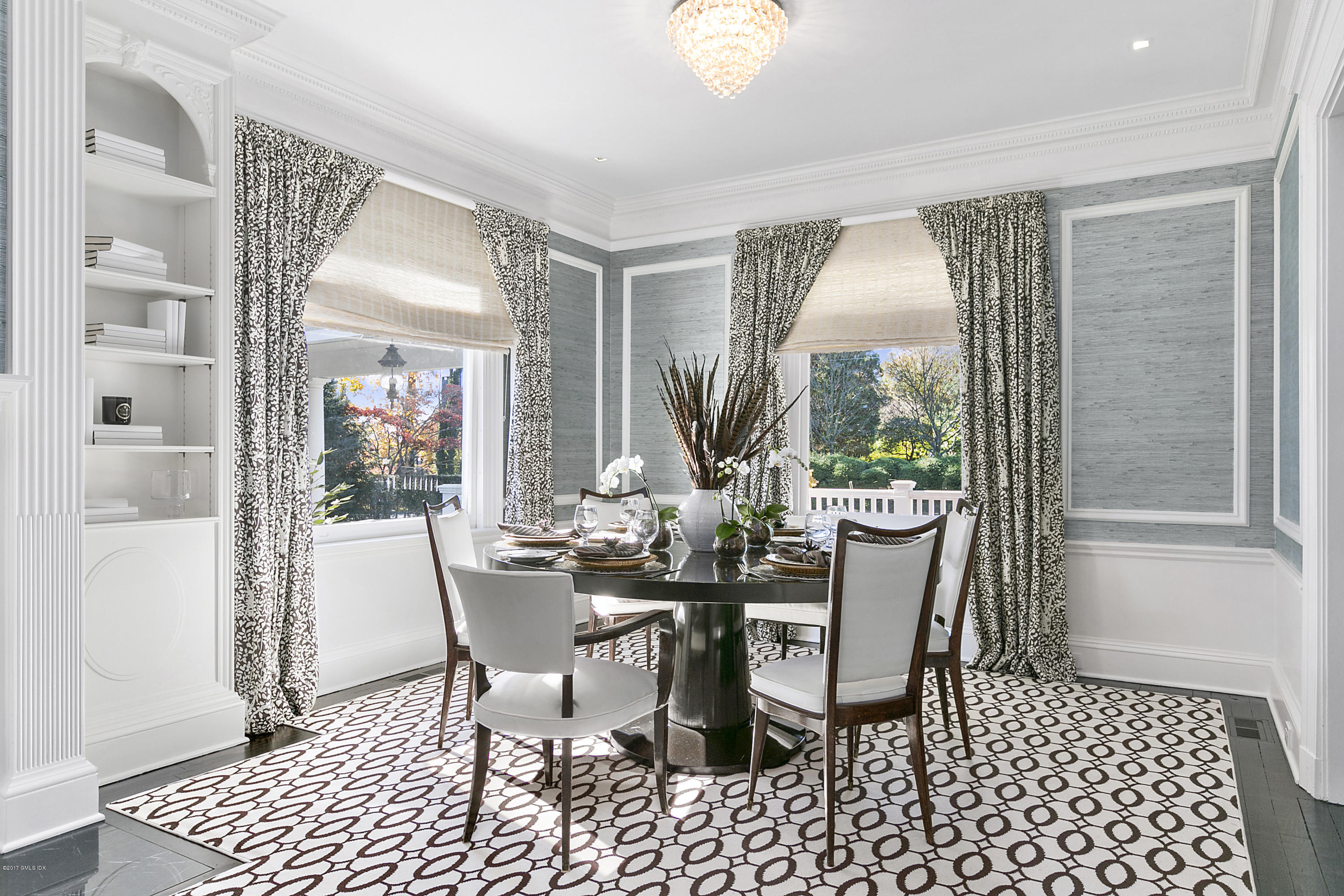 133 Otter Rock Drive Greenwich, CT 06830 - Photo 6 of 17 a view of a dining room with furniture wooden floor and a chandelier