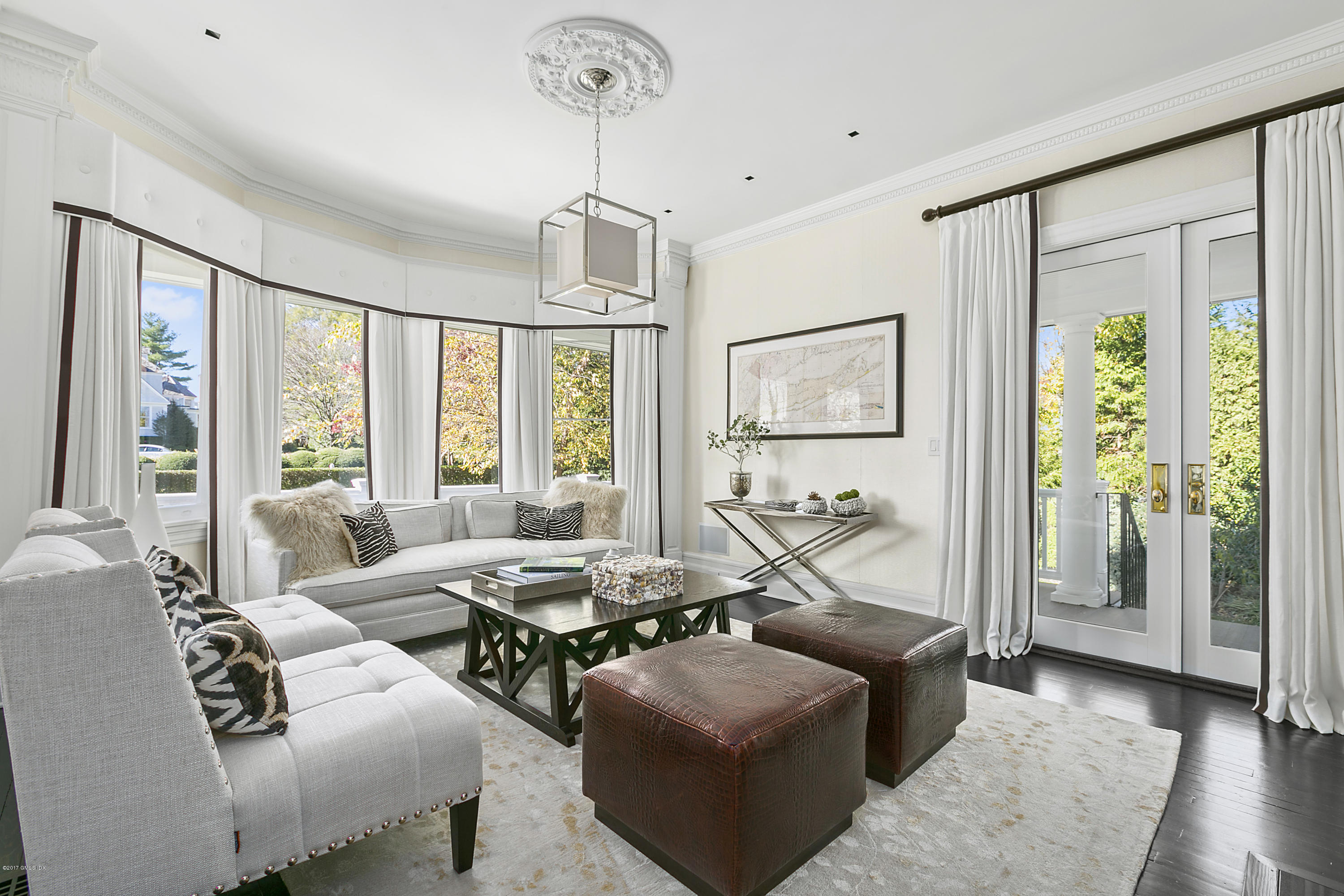 133 Otter Rock Drive Greenwich, CT 06830 - Photo 7 of 17 a bedroom with furniture and large windows