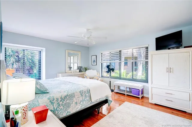 a view of a room with lots of white furniture