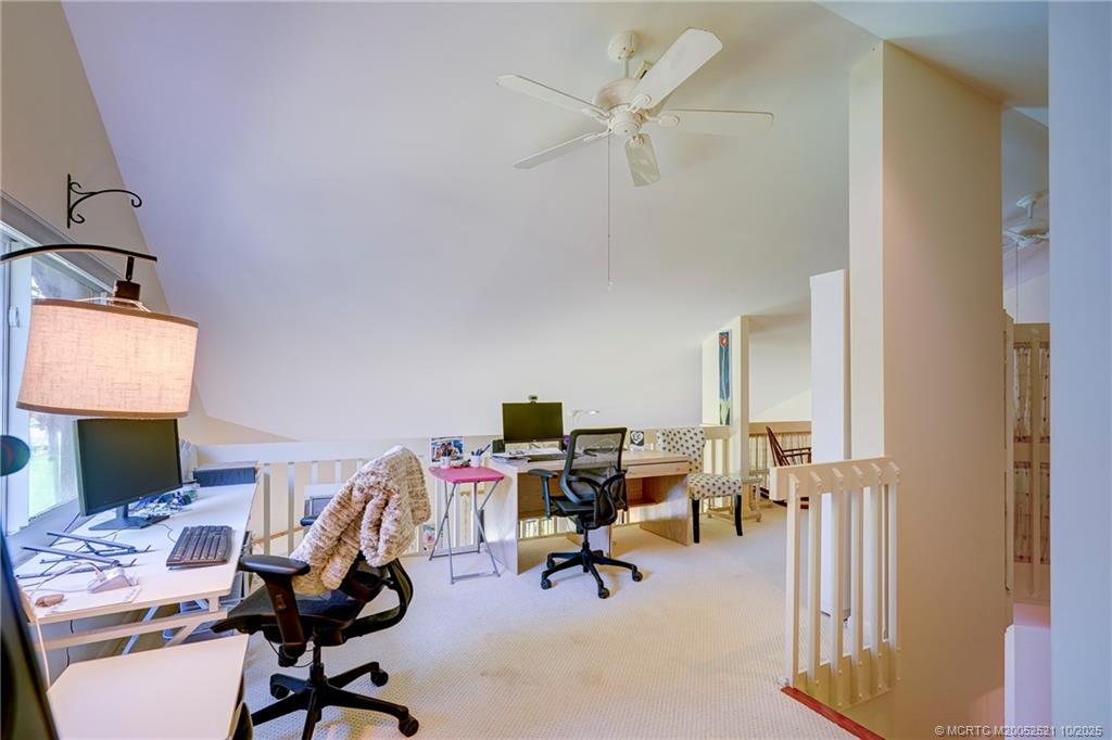 233 Northeast Edgewater Drive, Unit 201 Stuart, FL 34996 - Photo 40 of 64 a view of a workspace with furniture and a window