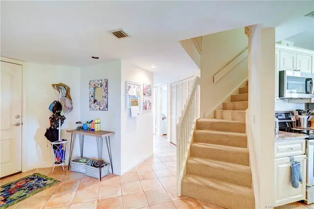 a view of hallway that has closet