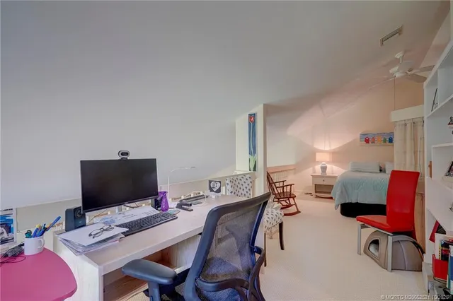 a view of a hallway with seating area