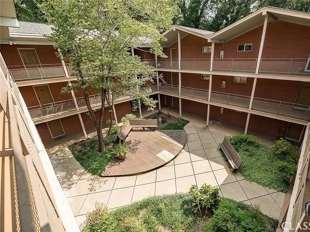 250 Little Street, Unit D107 Athens, GA 30605 - Photo 13 of 20 a backyard of a house with outdoor seating and plants