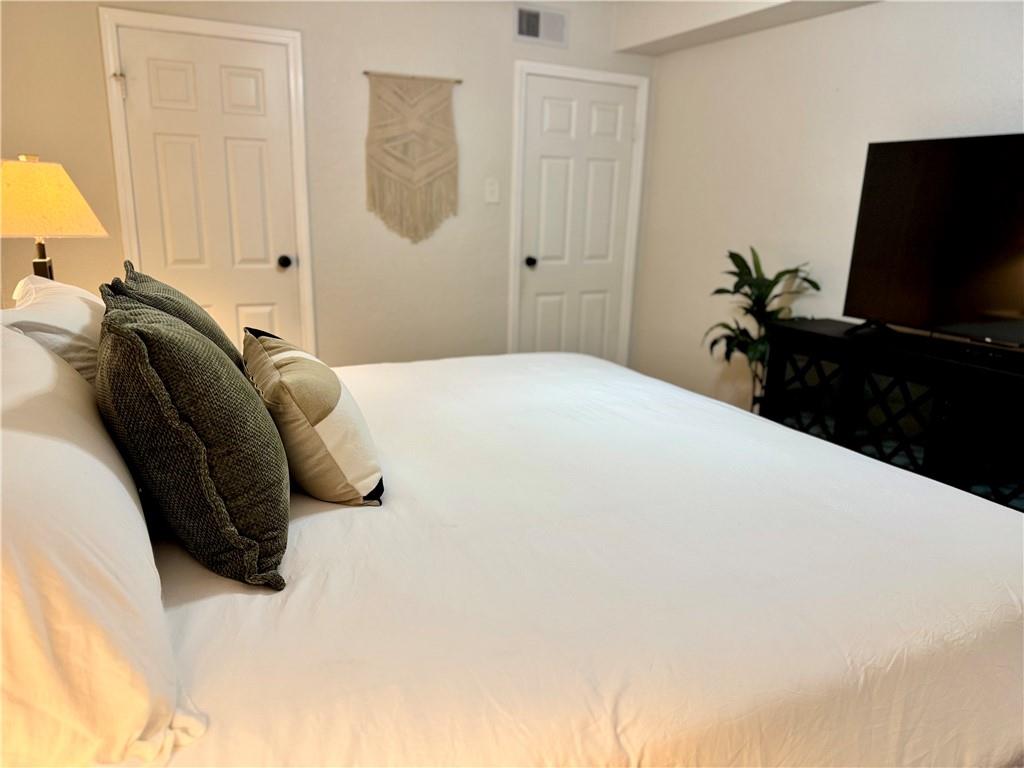 250 Little Street, Unit D107 Athens, GA 30605 - Photo 7 of 20 a bedroom with a bed and a window