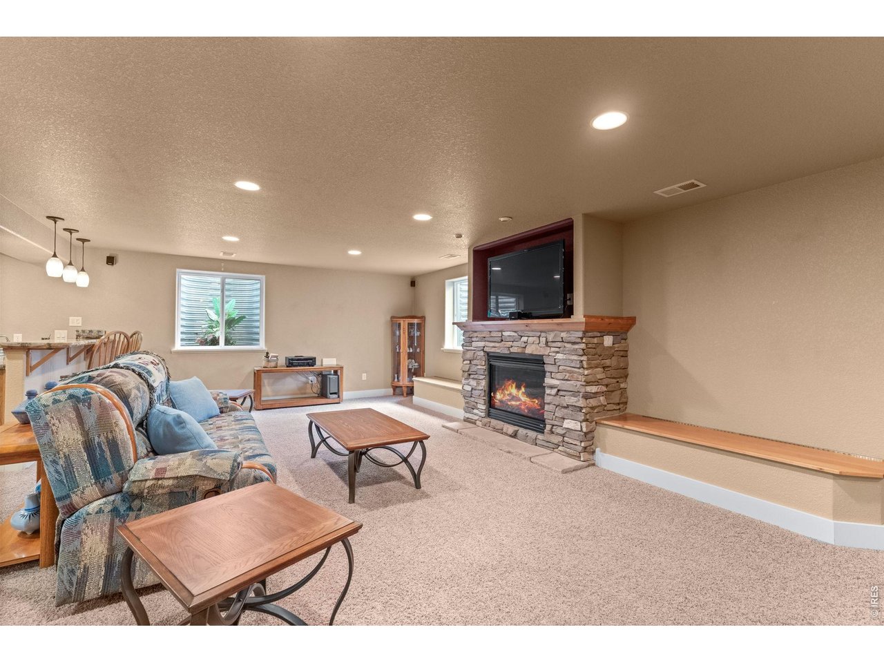 6710 31st St Road Greeley, CO 80634 - Photo 7 of 41 Huge family/rec room with fireplace in basement