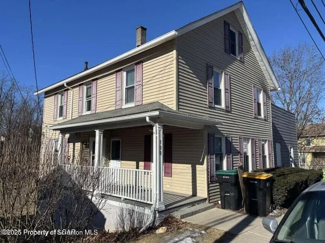 a front view of a house with balcony