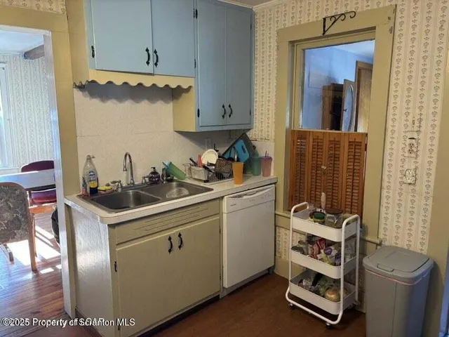 a kitchen with stainless steel appliances granite countertop a stove and a sink
