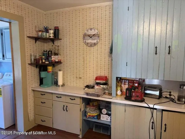 a kitchen with stainless steel appliances a sink and cabinets