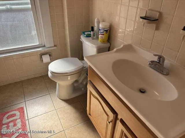 a bathroom with a sink and toilet