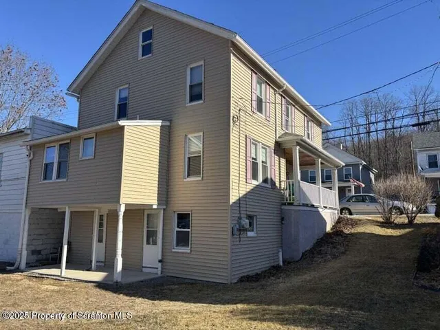 a view of a house with a patio