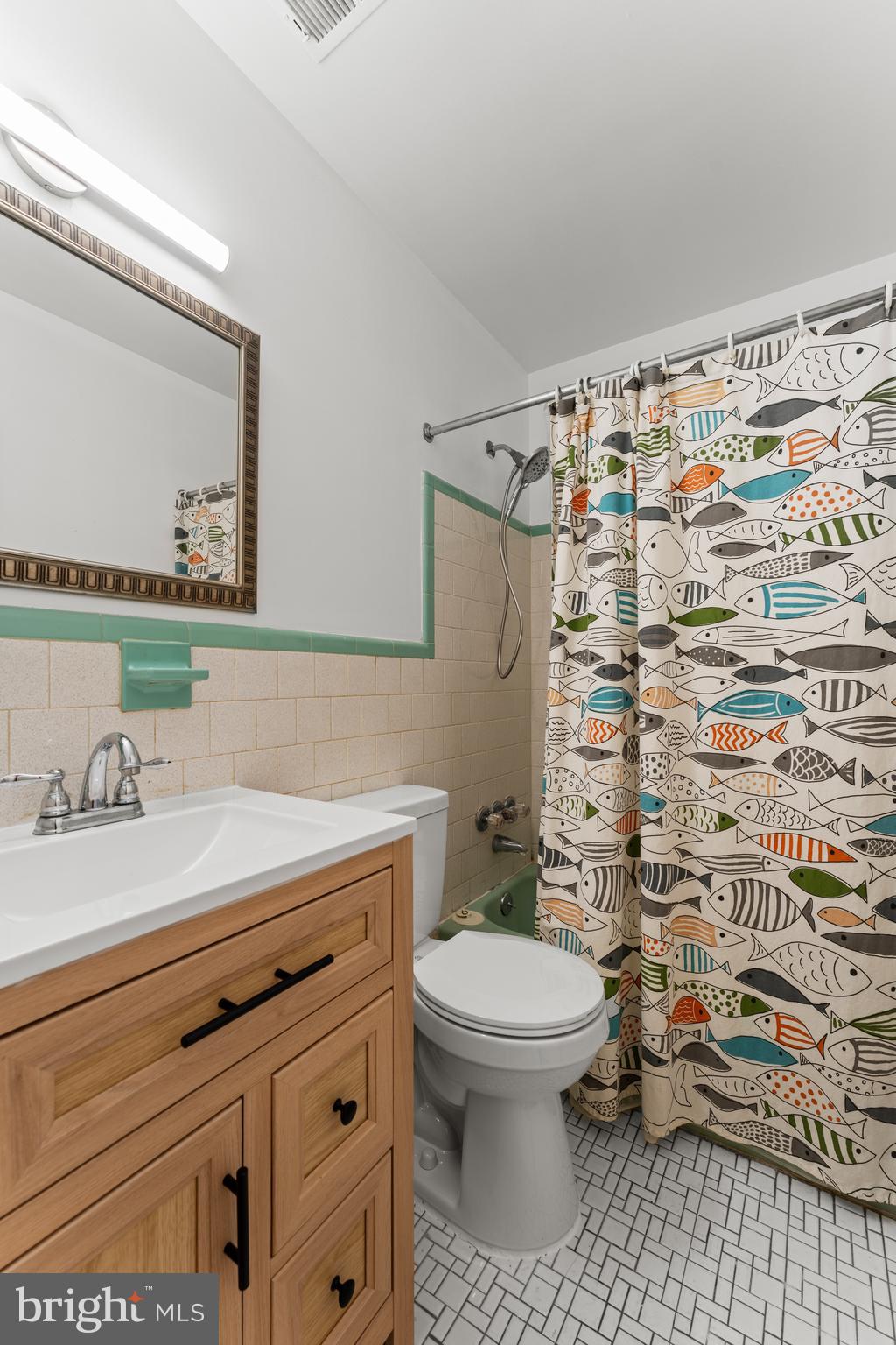 6805 Pamela Lane Clinton, MD 20735 - Photo 14 of 39 a bathroom with a sink toilet and shower