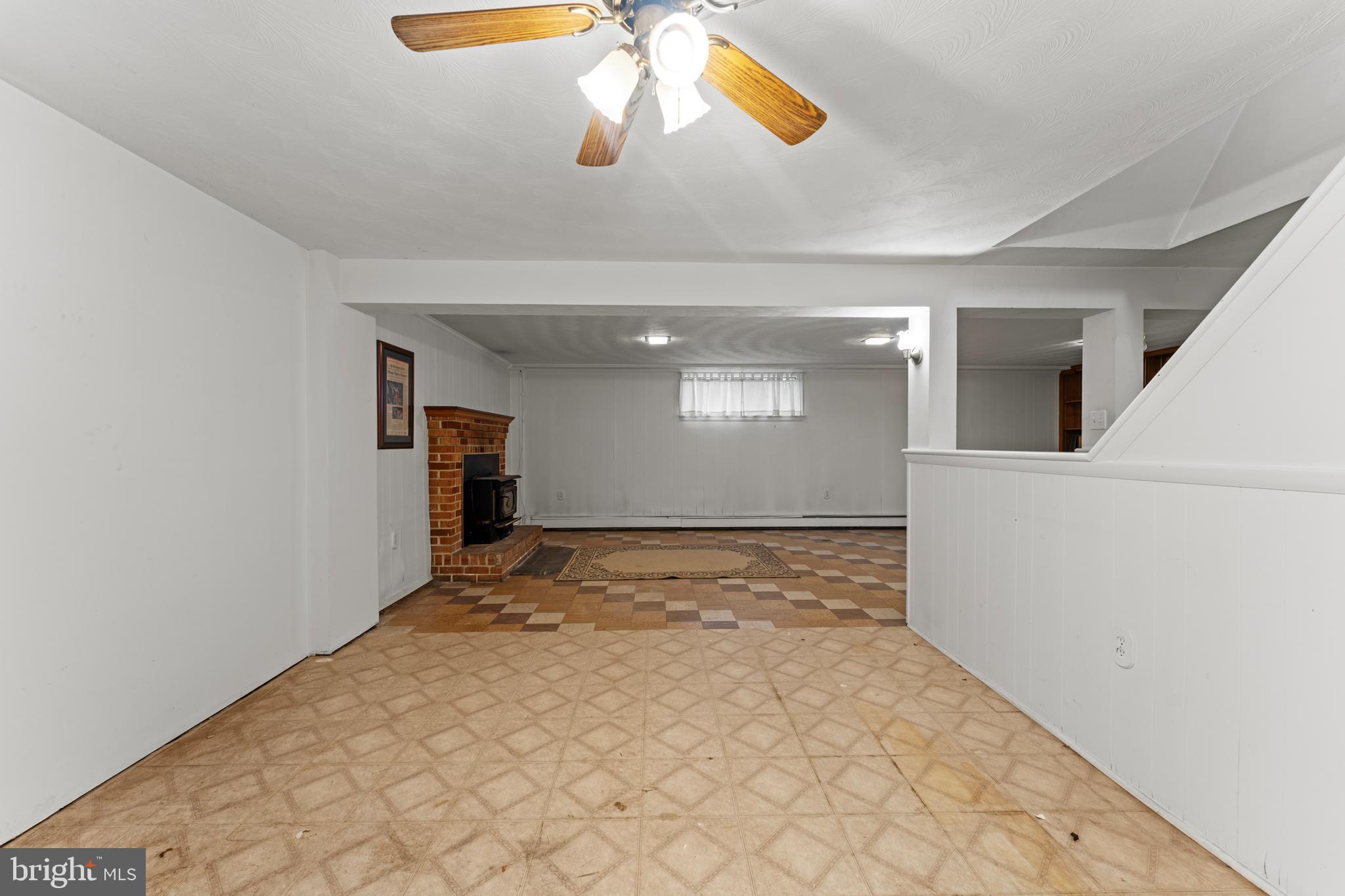 6805 Pamela Lane Clinton, MD 20735 - Photo 23 of 39 a view of a hallway with a chandelier