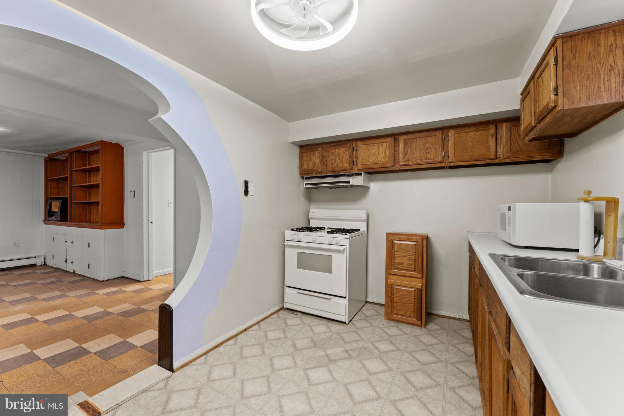 6805 Pamela Lane Clinton, MD 20735 - Photo 27 of 39 a kitchen with stainless steel appliances granite countertop a stove and a sink