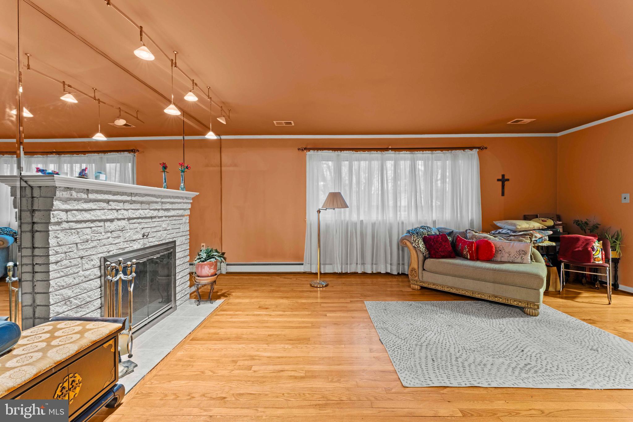 6805 Pamela Lane Clinton, MD 20735 - Photo 3 of 39 a living room with furniture and a fireplace