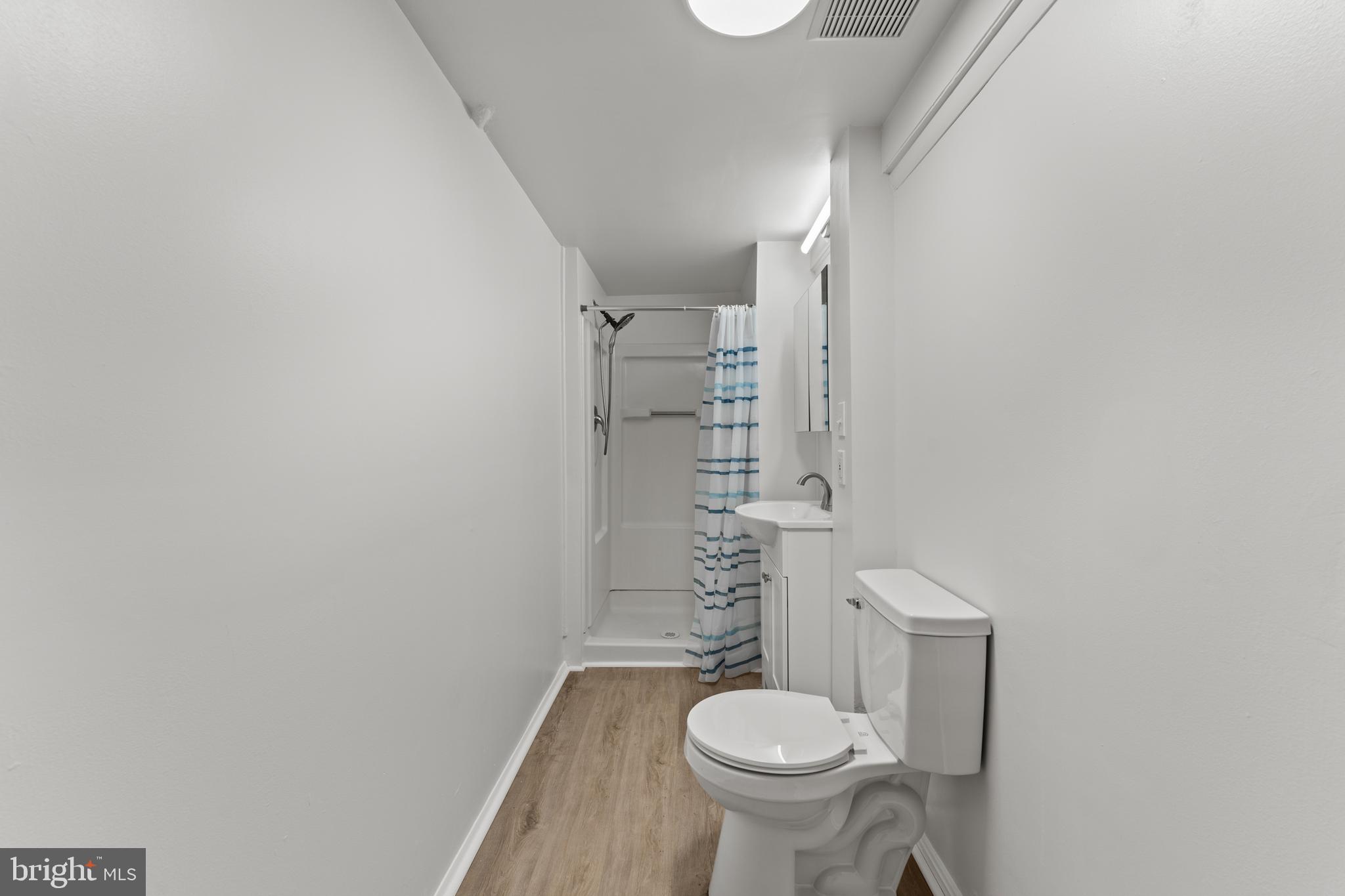 6805 Pamela Lane Clinton, MD 20735 - Photo 33 of 39 a bathroom with a sink and toilet