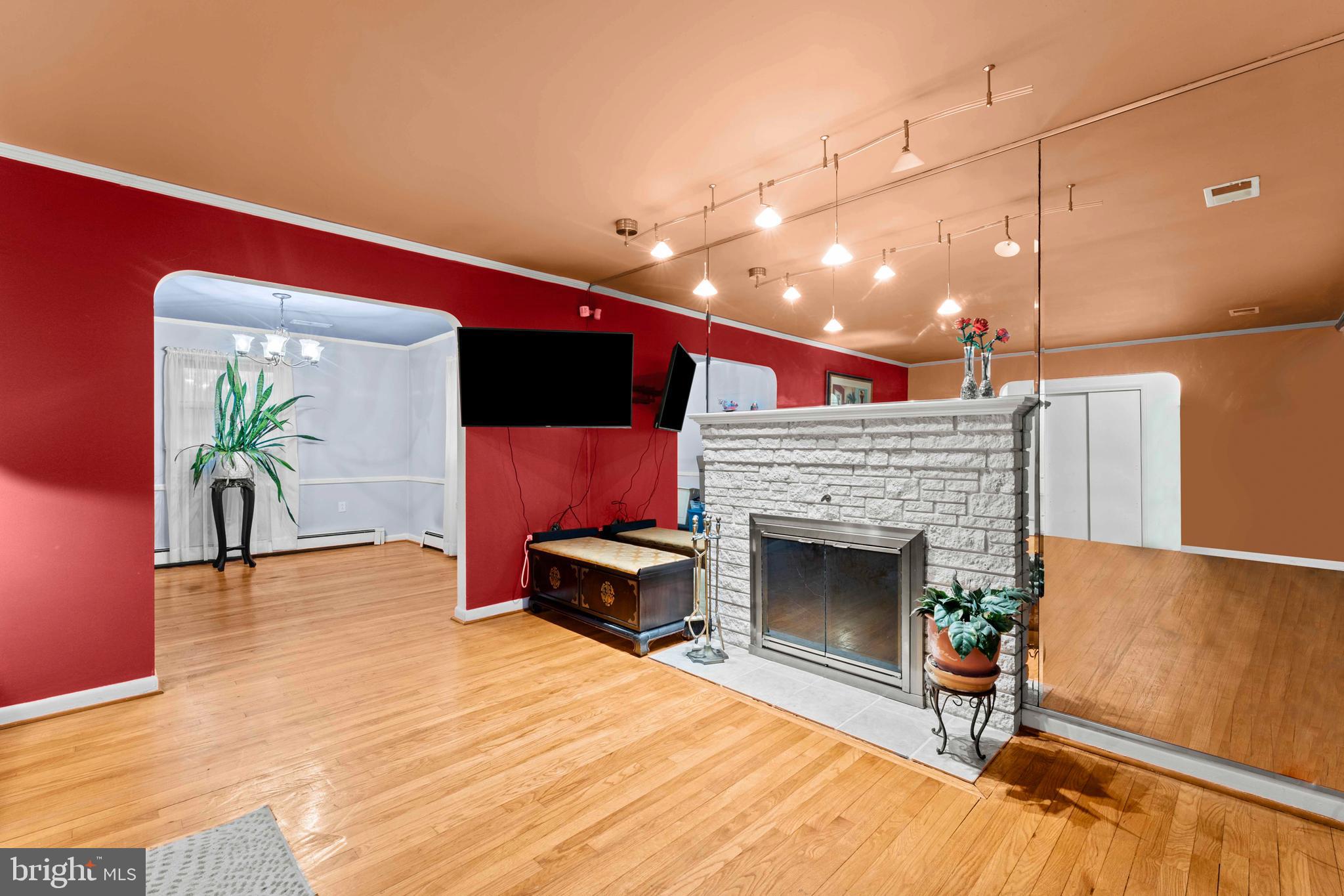 6805 Pamela Lane Clinton, MD 20735 - Photo 7 of 39 a living room with furniture and a fireplace