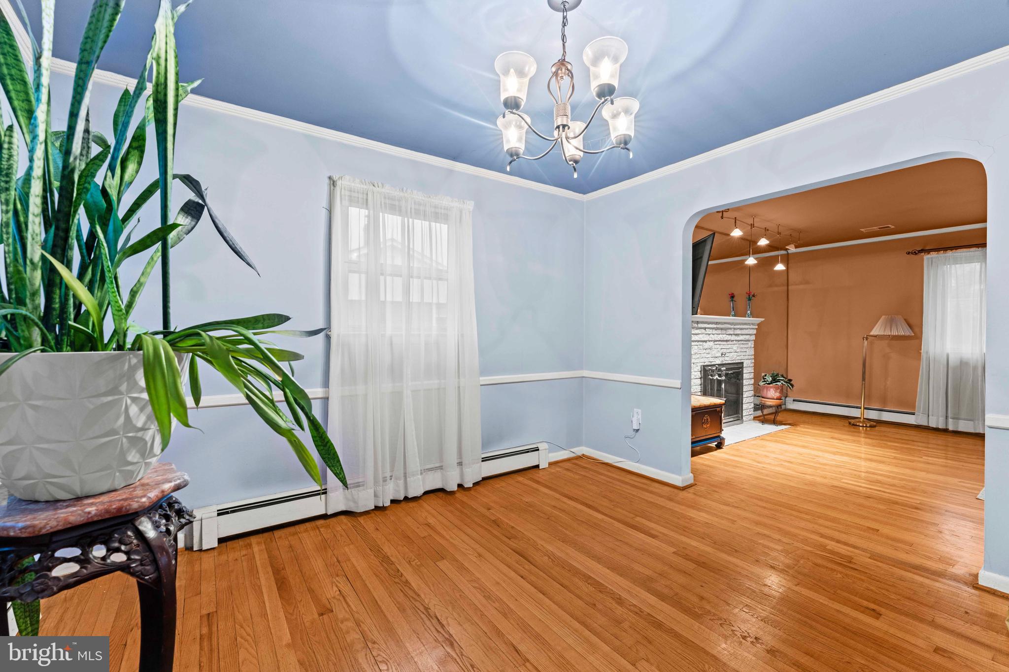 6805 Pamela Lane Clinton, MD 20735 - Photo 8 of 39 a view of empty room with wooden floor and fan