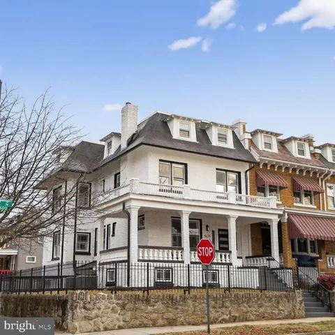 a front view of residential houses with street