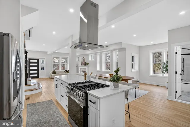 a kitchen with stainless steel appliances granite countertop a stove and a refrigerator