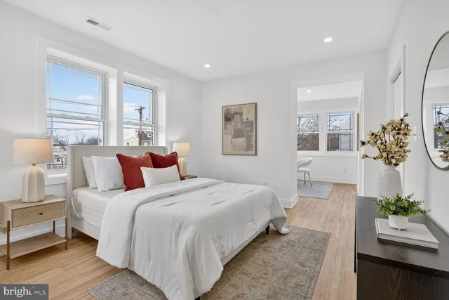 a bedroom with bed and a couch