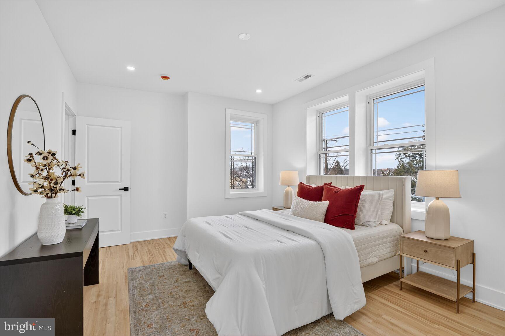 4629 9th Street Northwest Washington, DC 20011 - Photo 20 of 41 a bedroom with bed and wooden floor